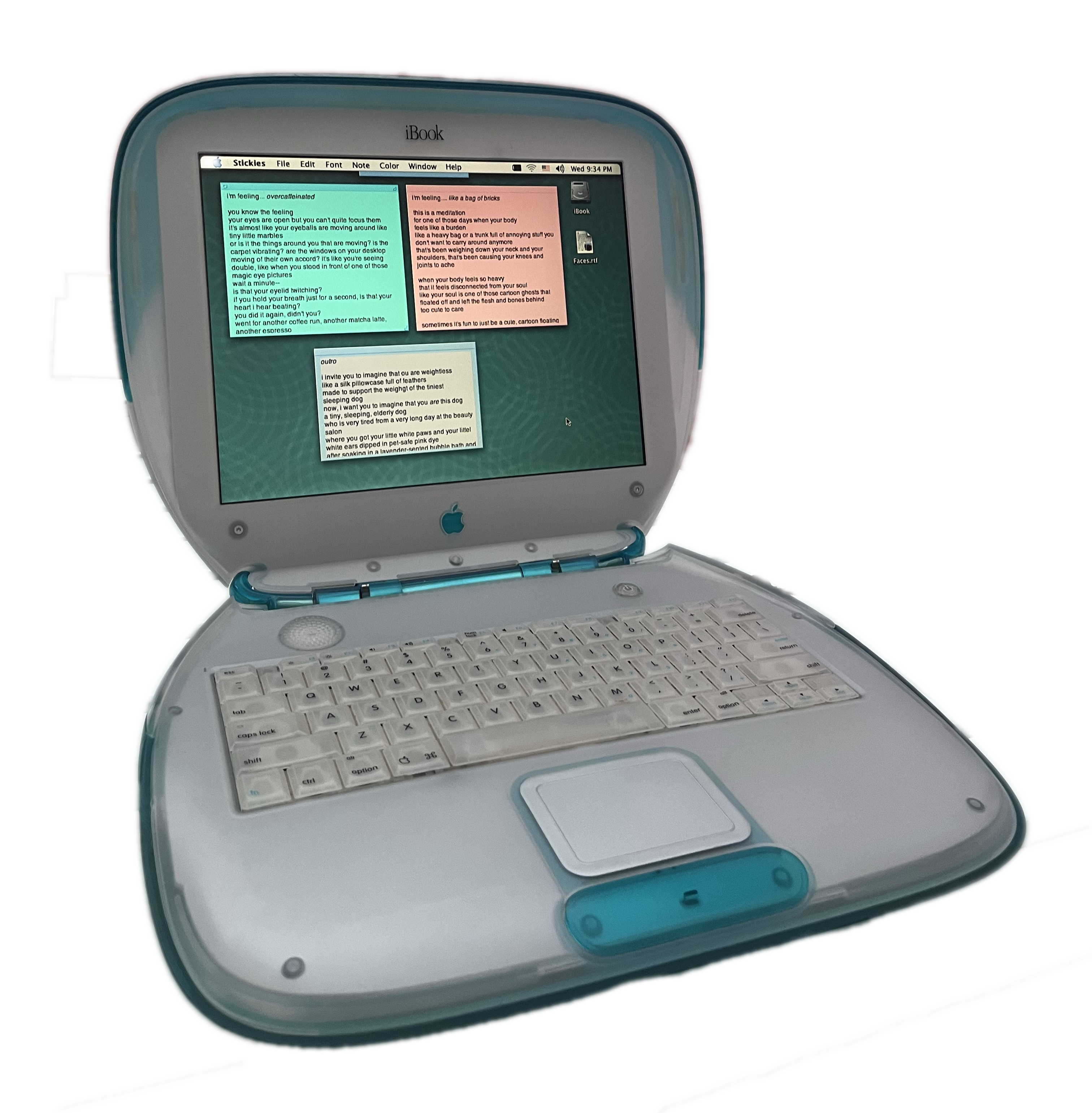 A Y2k teal clamshell Apple iBook laptop computer. The screen has the Stickies app open.